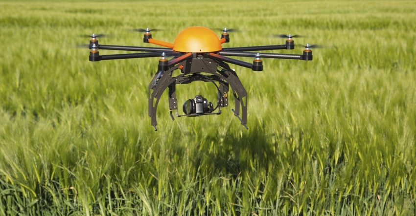 Drone flying above field
