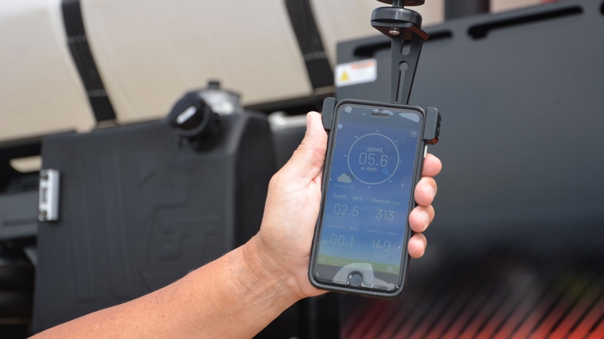 hand holding WatchDog portable wind sensor hand holding WatchDog portable wind sensor
