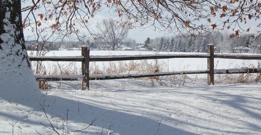 scenic snowy field and fence