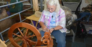 woman spinning wool