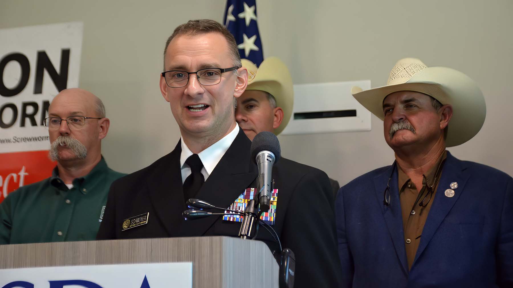 Rear Adm. Michael Schmoyer speaking at press conference