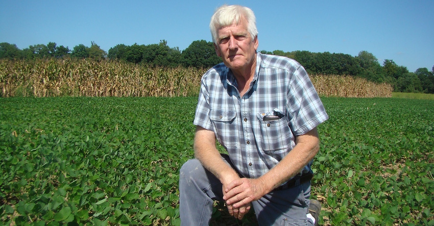 Ray McCormick in soybean field
