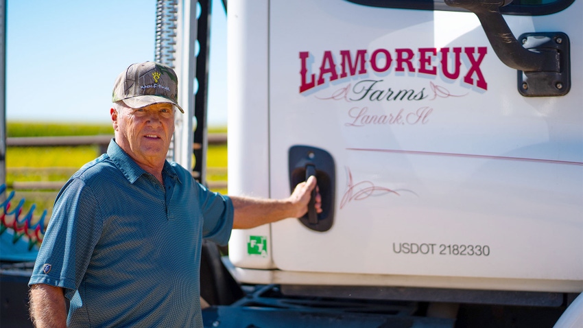  Lou Lamoreux of Lanark, Ill., stands next to his farm truck