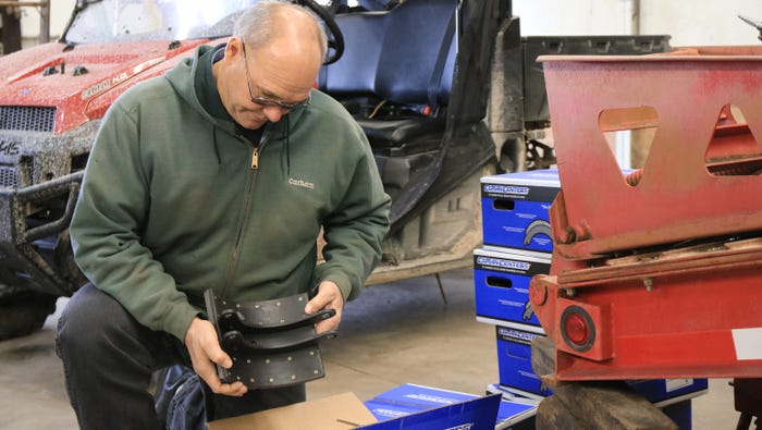 Jim Robbins working on replacing brakes