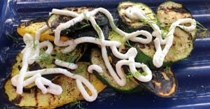 grilled zucchini topped with sour cream and dill