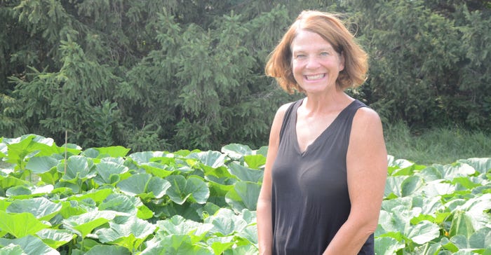 Tracy Van Diepen standing in a pumpkin field