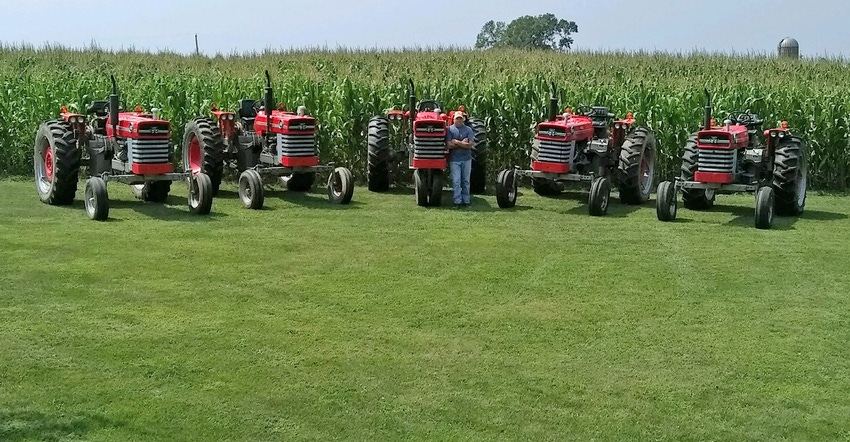 David Parr with five Massey Ferguson 180 tractors