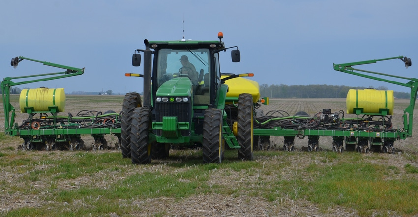 tractor planting corn into cover crop