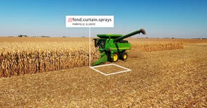 A combine using the what3words app sits at ///fond.curtain.sprays, a precise location for a farm field near Parkville, Ill