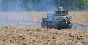 Dave Borneman, owner of Restoring Nature With Fire, riding a Argo ATV patrolling the fireline