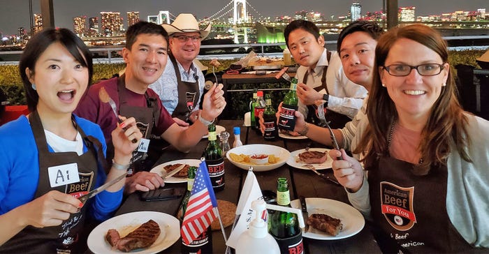 6 people enjoying beef at table