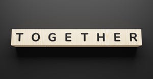 Together spelled with wooden cubes