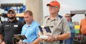 Dennis Bowman operates drone with controller