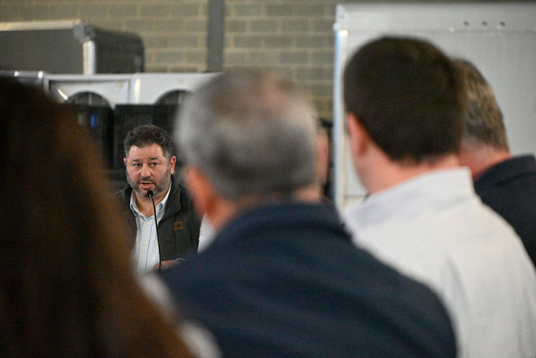 Chris Torres - View from audience of man speaking into microphone
