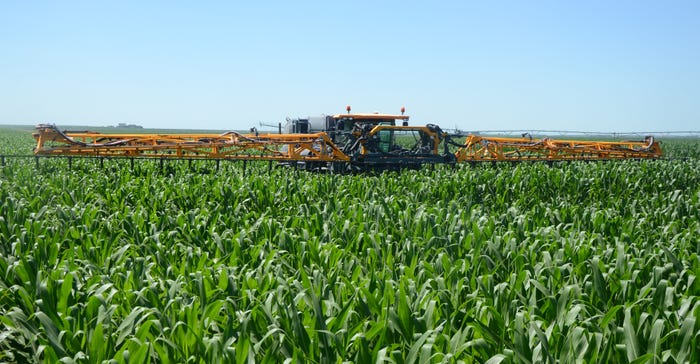  Tim Schmeeckle pilots his Hagie STS12 high-clearance machine through a cornfield on his farm near Gothenburg in summer 2019