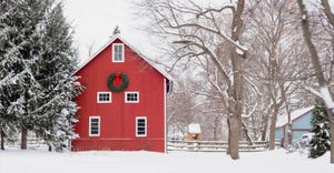 Red barn in the snow at Christmas time