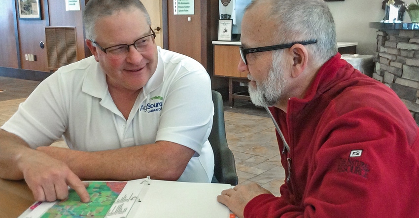 Chuck Bolte consults with a farmer on a nutrient management plan