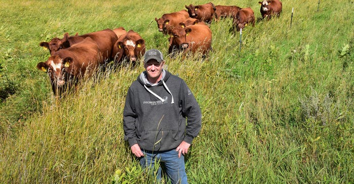 Todd Andresen checks on his herd of Red Angus cattle in Otter Tail County, Minn.