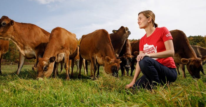  Julia Nunes with dairy cows in field