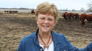 Patricia Wood standing in a cattle lot
