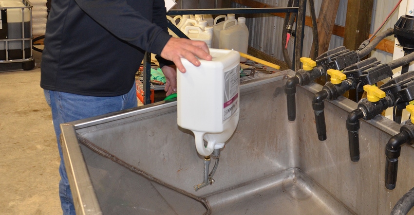 herbicide jug being rinsed out