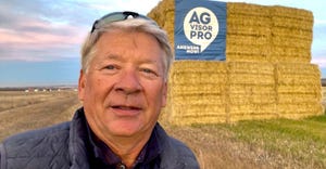 Rob Salik in front of advertisement for AGvisorPRO
