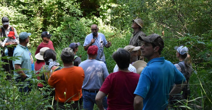: Bruce Carney, the second winner of PFI’s 2019 Master Researcher Award, is shown discussing a forestry project at a field day held on his family farm