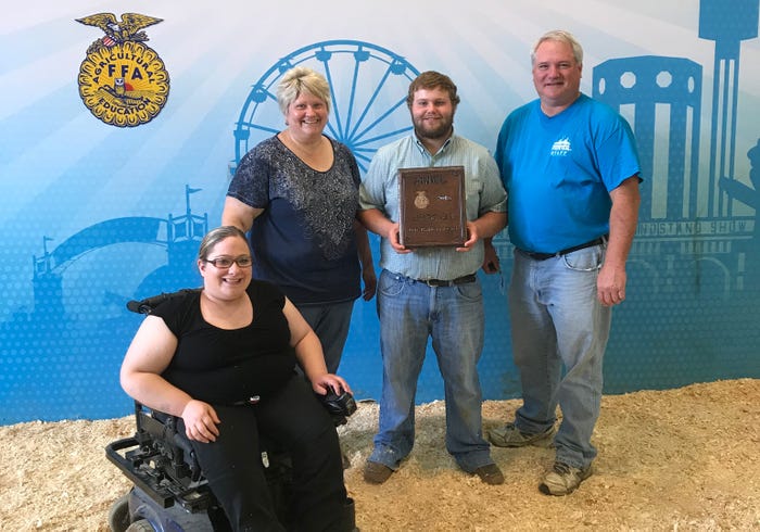 Abby, Gail, Riley and Jim Donkers, Faribault, Minn., pose with Riley and his 2018 D.K. Baldwin Award at the Minnesota State Fair