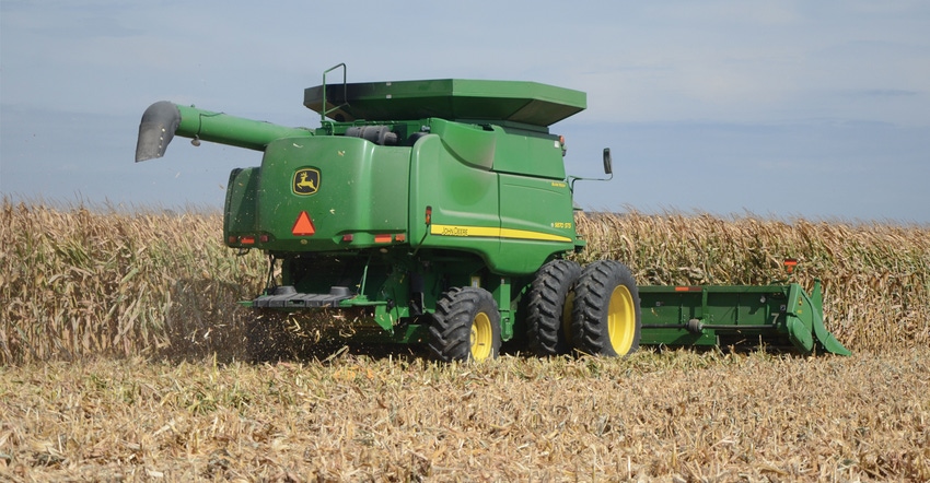 Combine in corn field