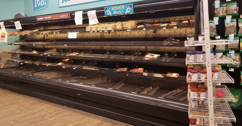 Empty meat cases at a grocery store