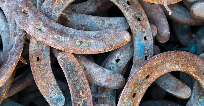 A pile of used horseshoes