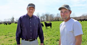 Tim Schnakenberg, left, with Lindell Mitchell in cattle pasture