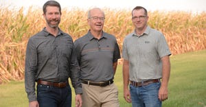 Bill, John and Blake Wyffels standing in front of cornfield