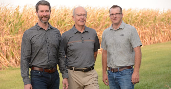 Bill, John and Blake Wyffels standing in front of cornfield Bill, John and Blake Wyffels standing in front of cornfield