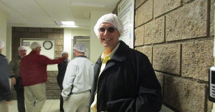 Nathan Larson’s in hair net working with the Kansas Grain Sorghum Commission