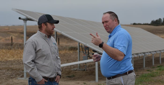 Matt Gunderson, Farmers National Company senior vice president of strategy, sales and marketing, visits with FNC farm manager Matt Gunderson, Farmers National Company senior vice president of strategy, sales and marketing, visits with FNC farm manager
