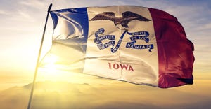 Iowa flag on sunny background