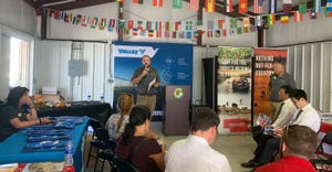International guests gathered at the International Visitors Center at Husker Harvest Days listening tlo speaker