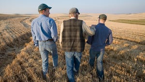  Three generations of farmers in wheat field