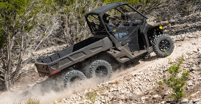 The 6x6 model Can-Am Defender climbs a steep hill