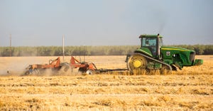 A farmer ploughs a field in Wasco in the Central Valley of California 