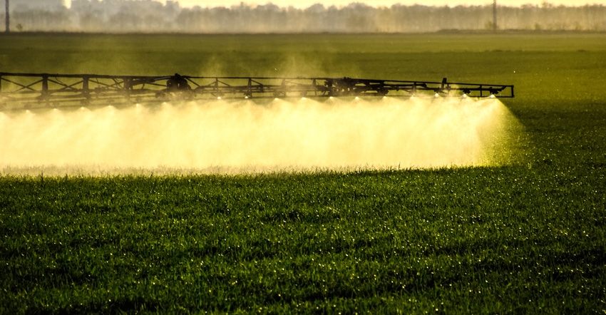 field being sprayed with fertilizer 
