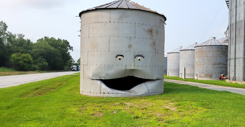 smiley face on damaged grain bin