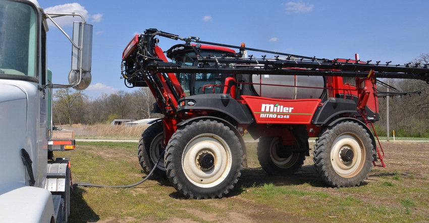 sprayer parked in field sprayer parked in field