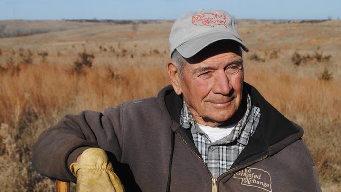 Wayne Rasmussen standing in field