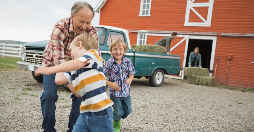 Grandfather playing with kids on farm Grandfather playing with kids on farm