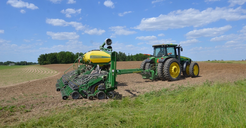 tractor and planter in field