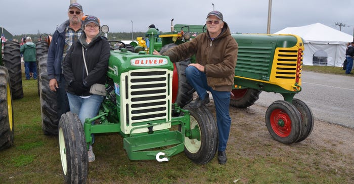 Mike, Theresa and Bob Thompson with their tractors
