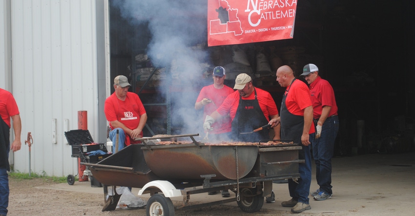 Farmers grilling lunch at a community event
