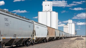 grain train with elevator in background